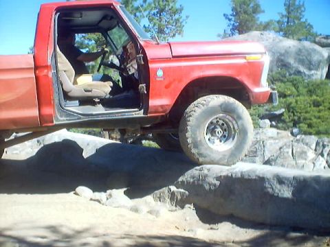 1976 Ford F-100 - This red pickup truck appears to be from the early to mid-1970s, not a 1976 model.