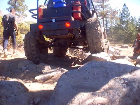 1976 Ford F-100 - An off-road vehicle tackles a challenging rocky trail, demonstrating its capabilities.