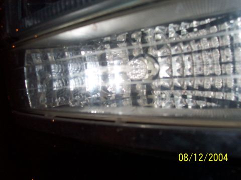 1994 Ford Bronco - Headlight assembly detail on a 1994 Ford Bronco, captured on 08/12/2004.