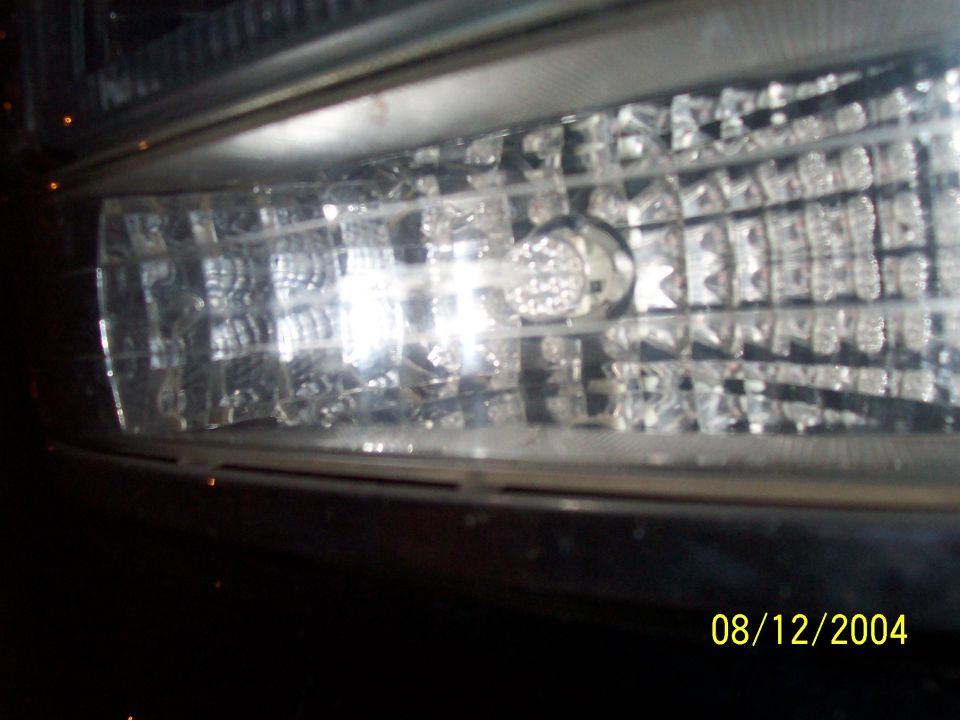 Close-up of 1994 Ford Bronco headlight assembly. Date stamp 08/12/2004