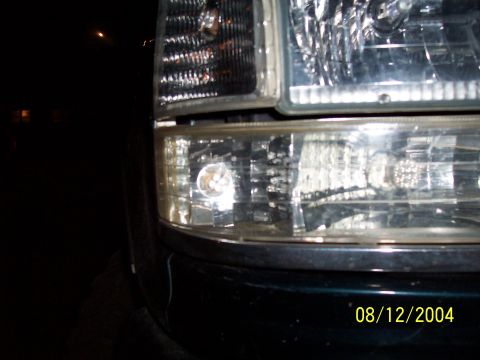 1994 Ford Bronco - A close-up view of a vehicle's front lighting system, with a date stamp visible in the lower right corner.
