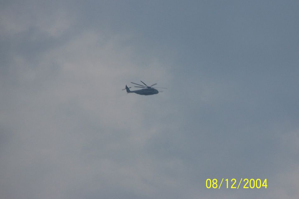 Helicopter flying in a cloudy sky