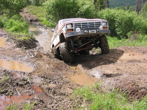 1985 Ford Bronco - This 1985 Ford Bronco tackles a challenging muddy off-road course.