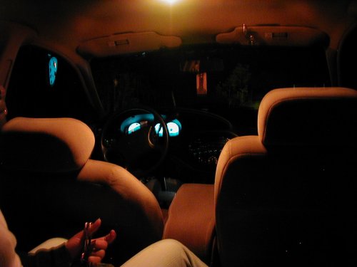1997 Ford Taurus interior at night, dashboard and seats visible