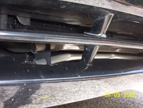 2003 Ford Taurus - Close-up view of the front grille and radiator of a 2003 Ford Taurus.
