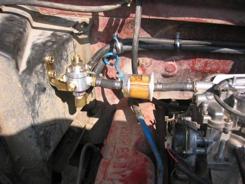1985 Ford Bronco - Close-up of the fuel system components, including a new fuel filter and regulator, installed in the engine bay.
