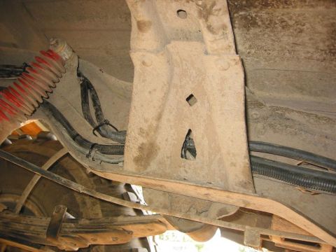 1985 Ford Bronco - Undercarriage view reveals suspension components and wiring, but year and model are not identifiable.