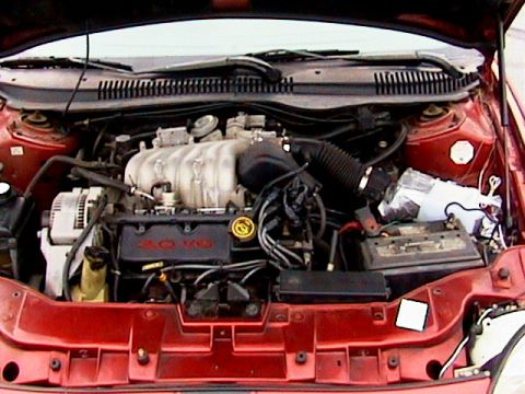 1996 Ford Taurus - The engine bay of a 1996 Ford Taurus, clearly showing the 3.0 V6 engine.