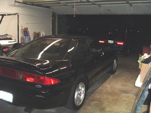 1995 Ford Probe - Crappy picture of the black PGT in the garage and the blue on in the driveway