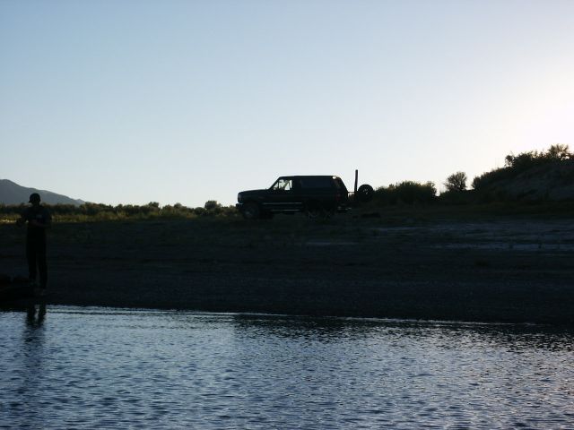 Dark SUV with spare tire on rear, 1996 Ford Bronco