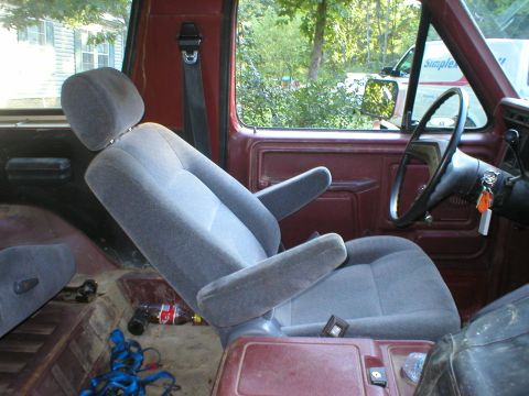 1986 Ford Bronco - Interior view of an older SUV, showing the driver's seat and dashboard area.