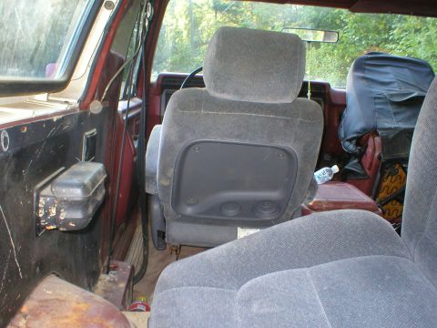 1986 Ford Bronco - Interior view of a 1986 Ford Bronco, focusing on the seats and door panel.
