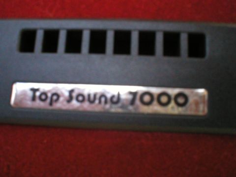 1986 Ford Bronco - A close-up view of the 'Top Sound 7000' badge, likely from a car stereo system.