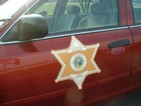 1999 Ford Crown Victoria - Side view of a 1999 Ford Crown Victoria police car, showing the Asotin Town Marshal badge.