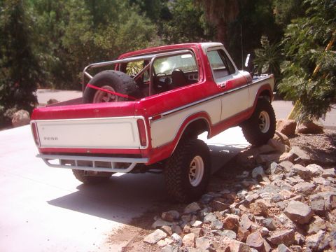 1978 Ford Bronco - Drove up on a rock to see how it works. Only one bolt in the spring so couldn't go too extreme