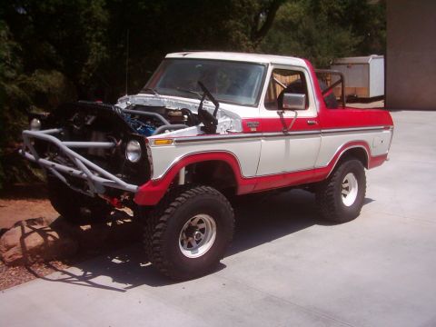 1978 Ford Bronco - This modified 1978 Ford Bronco features a custom front bumper and its engine is exposed for viewing.