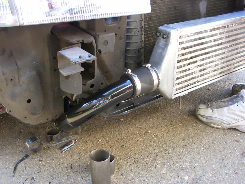 Intercooler piping connected to a vehicle's radiator support