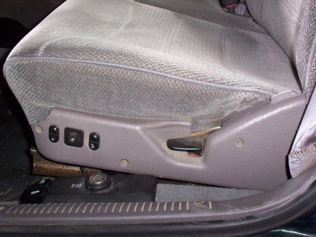 Before replacement of driver's seat side panel.
