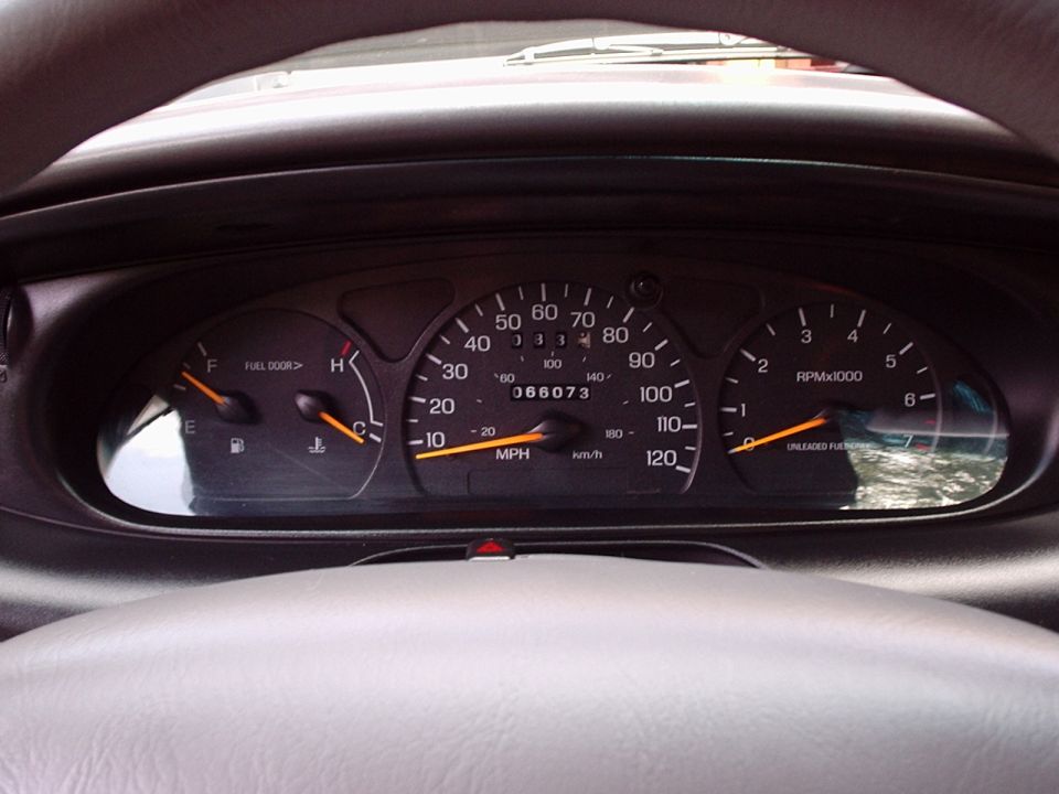 Gauge cluster with 120 mph speedometer and 066073-mile odometer reading