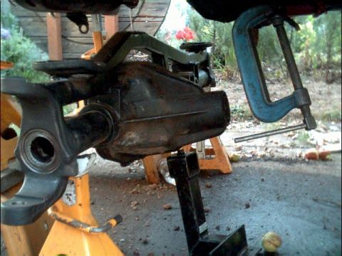 1978 Ford Bronco - Differential assembly is secured with jack stands and a clamp during work.