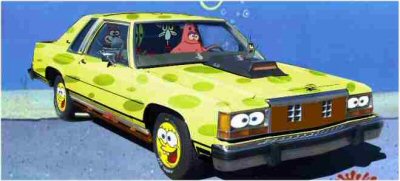 1985 Ford LTD Crown Victoria - This 1985 Ford Crown Victoria LTD has been customized with a yellow and green polka dot paint scheme and cartoon eyes on the headlights.