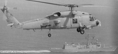 1993 Ford Bronco - A Sikorsky helicopter flies over a ship at sea.