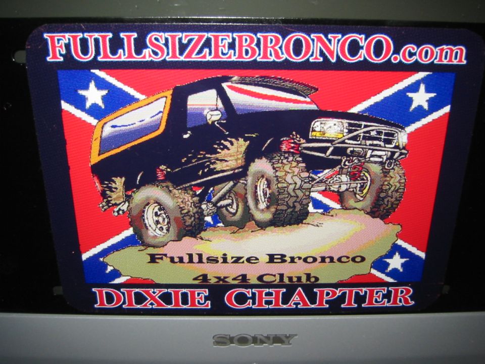 FullsizeBronco.com Dixie Chapter club plate with cartoon lifted Bronco graphic on flag background