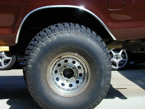 1979 Ford Bronco - 33" next to the new 37"