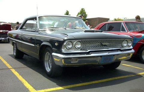 1967 Ford LTD - This 1967 Ford LTD coupe features a distinctive chrome grille and dual headlights, captured in a three-quarter front view.