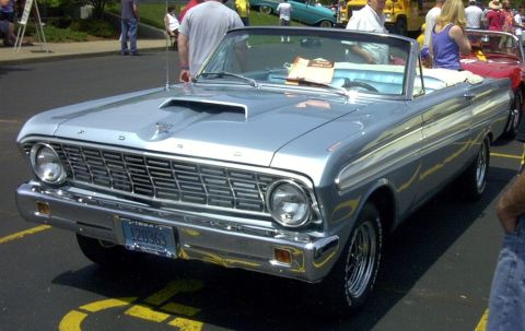 1967 Ford LTD - A light blue 1964 Ford Falcon convertible is parked at an outdoor event with other vehicles.