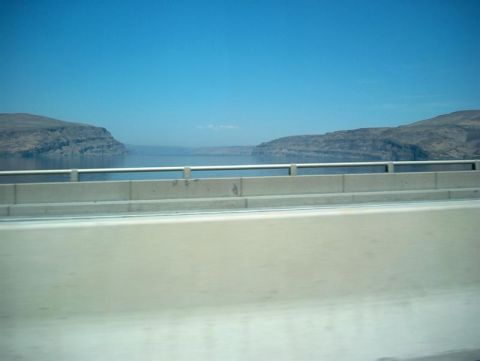 2001 Ford Crown Victoria - A scenic view of water and hills is captured from a bridge, with a Supermotors.net logo visible at the bottom right.