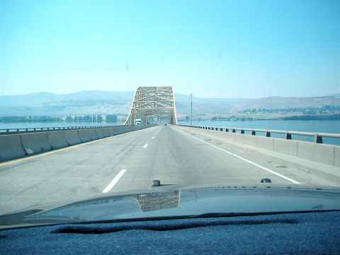 2001 Ford Crown Victoria - View from the dashboard as the vehicle crosses a bridge over a wide body of water.