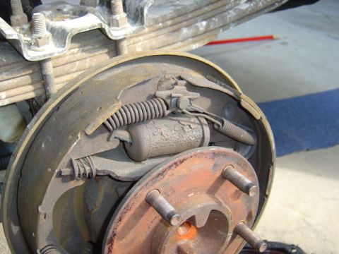 1996 Ford Bronco - Can you see what's wrong? The pad is gone... and also, the axle part isnt sposed to move in and out about 1/4" is it?? :-)