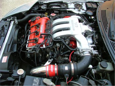 1995 Ford Probe - Close-up view of a V6 engine bay, showing the intake and valve covers.