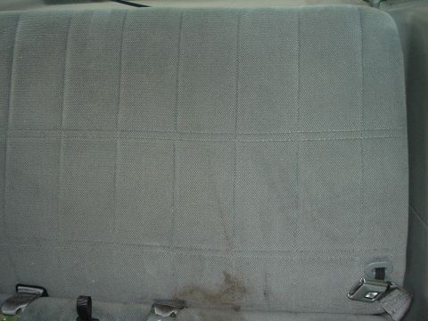1989 Ford Escort - Close-up of car seat fabric, showing stitching pattern and minor wear.