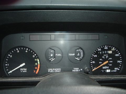 1989 Ford Escort - The dashboard displays the RPM, fuel level, engine temperature, and speed, with the odometer reading 147,291.