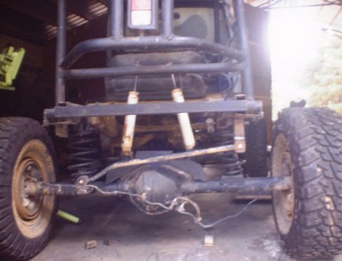 1989 Ford Bronco - Rear view of an off-road vehicle's chassis, showing suspension and axle details.