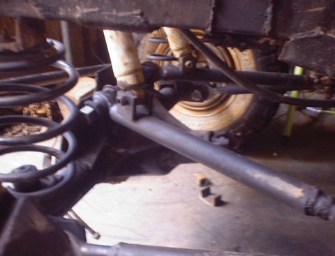 1989 Ford Bronco - Undercarriage view of a vehicle's suspension, with focus on the springs and shock absorbers.