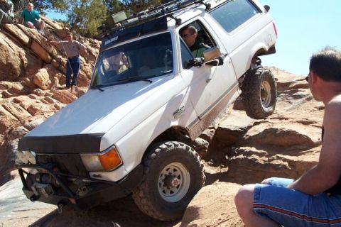 1990 Ford Bronco - This 1990 Ford Bronco navigates a challenging off-road obstacle.