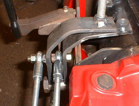 1990 Ford Bronco - Detail of mechanical linkage and a red component, with a watermark from Supermotors.net visible.