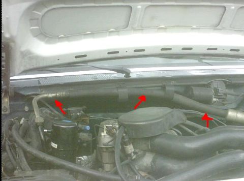 1992 Ford Bronco - Close-up view of the engine bay in a 1992 Ford Bronco, with several parts highlighted by red arrows.