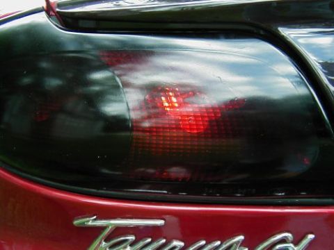 1997 Ford Taurus - The rear of a 1997 Ford Taurus shows off its modified, tinted tail lights.