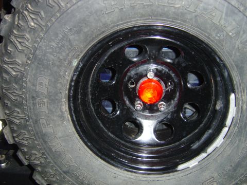 2002 Jeep Wrangler - Wheel detail from a Jeep Wrangler, an aftermarket orange marker light.