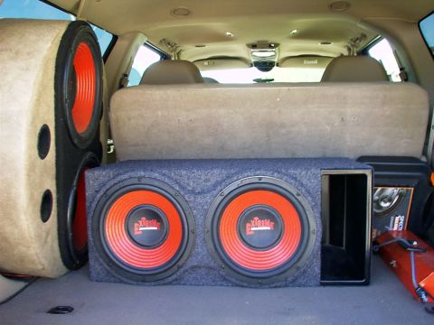 2000 Ford Excursion - Custom speaker box with dual subwoofers installed in the cargo area of an SUV.