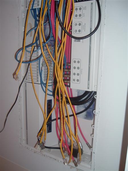 2000 Honda Accord - A close-up view of a complex network wiring setup multiple distribution modules and a tangle of colorful cables.