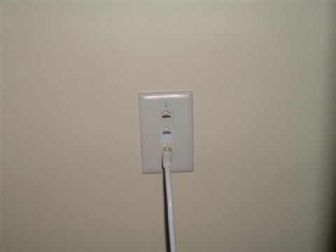 2000 Honda Accord - Wall plate with network and coaxial connectors, a white cable is plugged into the coaxial port.