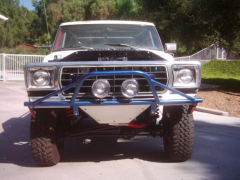 1978 Ford Bronco - Front view of a 1978 Ford Bronco modified for off-road use with a prominent blue bull bar.