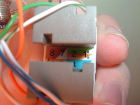 2000 Honda Accord - A close-up view of a network cable connector, showing wires and numerical labels for connections.