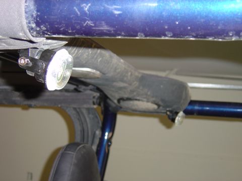 2002 Jeep Wrangler - Close-up view of an interior light mounted on the roll cage of a 2002 Jeep Wrangler.