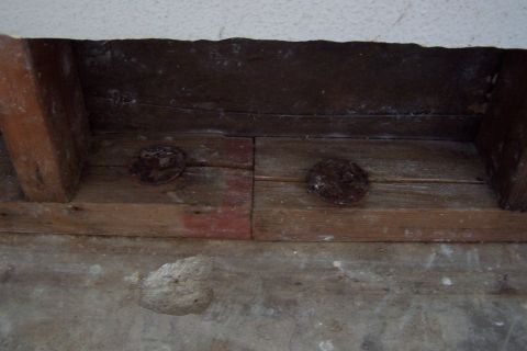 1990 Ford Bronco - Metal washers? nailed to bottom of wall frame